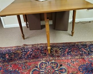This table with pads is custom-made and matches the corner cabinet.
