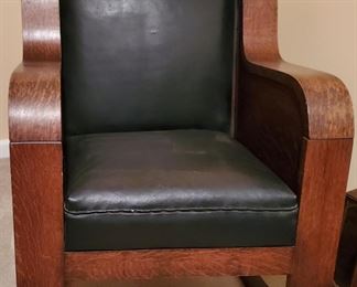 There are two pieces in the Empire style but each will be priced separately.  Purchased in Maryland, this is an rocker with black leather seat, back of seat, and back of chair.  Wide wooden arms that are gorgeous.  The other piece is a stationary chair.