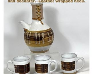 Lot 1736 Martz for Marshall Studios mugs and decanter. Leather wrapped neck. 