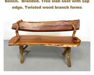 Lot 1857 Studio Woodworker Live Edge Bench. Branded. Tree slab seat with sap edge. Twisted wood branch forms