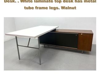 Lot 1957 George Nelson for Herman Miller L Desk. . White laminate top desk has metal tube frame legs. Walnut 