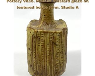 Lot 1972 Modernist RAYMOND GALLUCCI Art Pottery Vase. Mottled mustard glaze on textured bottle form. Studio A