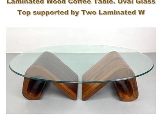 Lot 2006 Artisan Studio Hand Crafted Laminated Wood Coffee Table. Oval Glass Top supported by Two Laminated W