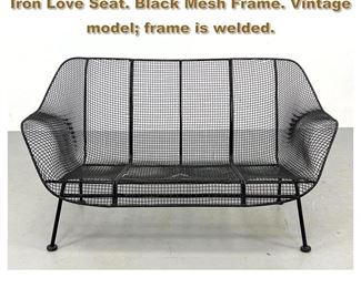 Lot 2122 RUSSELL WOODARD Sculptura Iron Love Seat. Black Mesh Frame. Vintage model frame is welded.