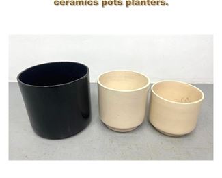 Lot 2175 Three in the style of Gainey ceramics pots planters. 