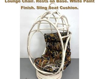 Lot 2257 Woven Rattan Egg Form Modernist Lounge Chair. Rests on Base. White Paint Finish. Sling Seat Cushion.