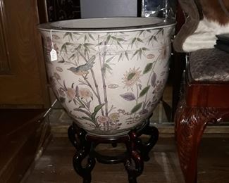 Very large fish bowl on rosewood stand.