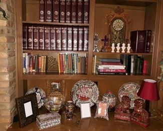 Library cases of a collection of National Geographic magazines and maps, Asian pottery, hardback books, Ingraham mantle clock, and more.
