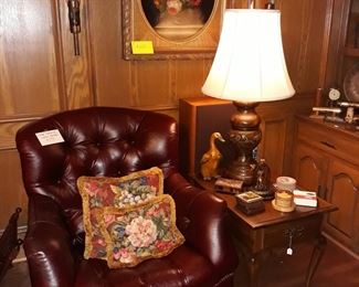Vintage leather chair, original oil painting, vintage Knob Creek lamp, coaster sets, and more.