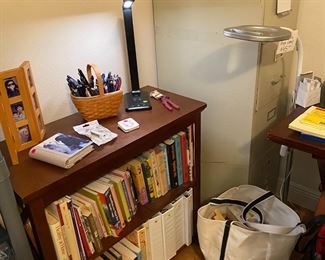 bookshelf, file cabinet, ottlite floor lamp