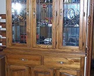 Amish oak china hutch with Harley-Davidson collectibles
