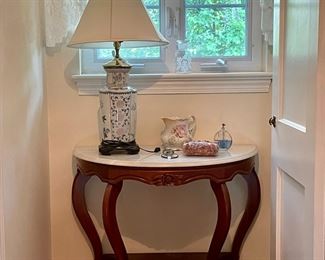 Vintage marble-top demi-lune table.