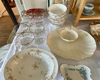 Set of new Christopher Stuart fine china cereal/soup bowls, Lenox shrimp cocktail platter and gold-rimmed champagne glasses.