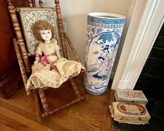 Victorian Eastlake child's rocking chair and antique porcelain head sleeper doll.