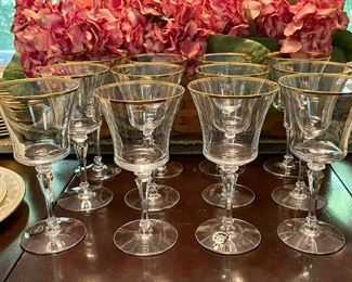 One of a few sets of vintage Tiffin Franciscan gold-rimmed crystal stemware glasses.