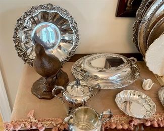 Lots of silver-plated serving pieces.