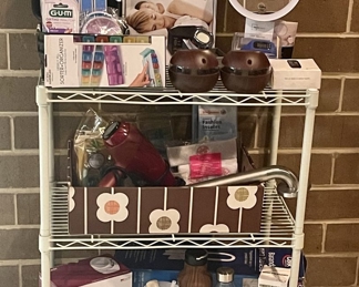 Self-care and medical items, magnified mirror, and sturdy white stand