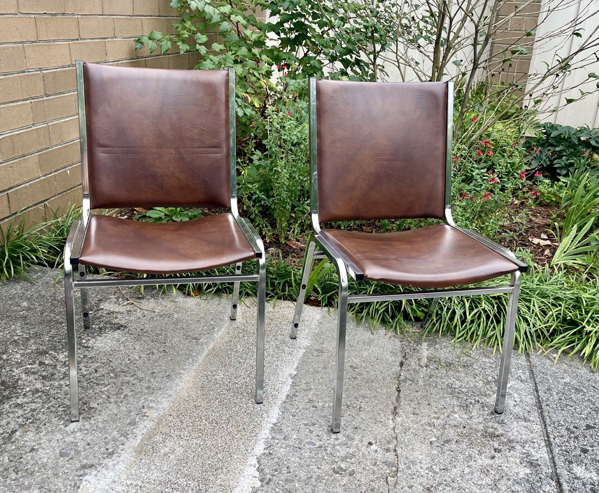 2 of 8 brown chairs 