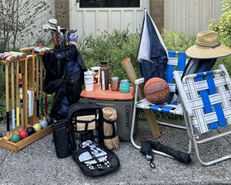 Time to head outside - hats, picnic packs, folding chairs, assorted water bottles, umbrellas, and sports equipment -  Game on!
