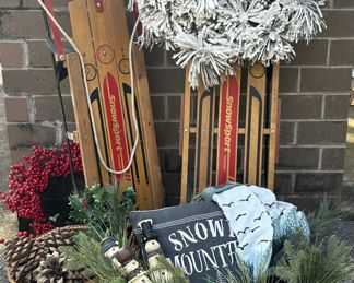 Baby, It's cold outside!  Sleds, starter logs, wreaths, and fabulous oversized pine cones.