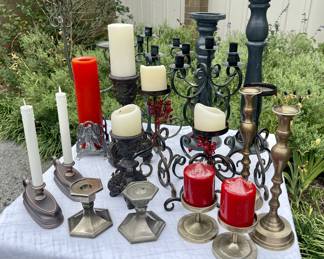 Candlesticks and candelabras - many shapes, sizes, and styles.  Picture is a snapshot of a much larger selection.