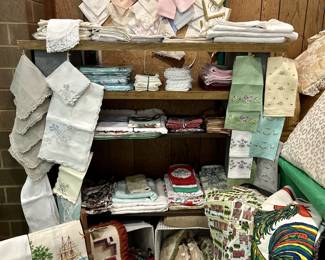 Linens galore - handkerchiefs, cloth napkins, tea towels, hand towels.  Another snapshot of a much larger selection.