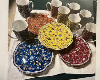 Beautiful Silk Road china by Takahashi;   Four Colors, Floral, Gold Trim. Set includes:  8 dessert/pie plates (2 blue, 2 orange, 2 red, 2 yellow) and 8 mugs (2 blue, 2 orange, 2 red, 2 yellow).  Mint condition