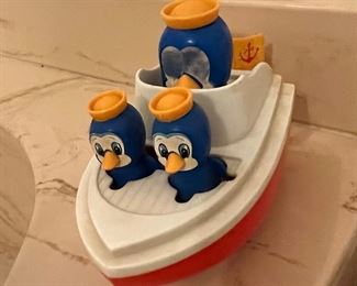 1981 Penguin Boat wind-up toy.