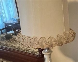 White ceramic table/dresser lamp with dainty floral details and a frilly shade.  Vintage Cottagecore/Grannycore.