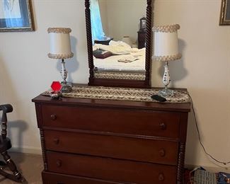 This is the most beautiful matching Cherry wood antique bedroom set that you have ever seen.  This magnificent set has been cared for like you wouldn't believe.  There is a vanity, a dresser, chest of drawers, two night stands, and a headboard & footboard (which is not pictured here, as it was located in the basement.)