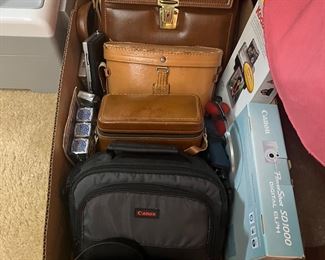 Various Binoculars, cameras, flashcubes, etc.