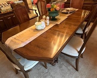 Ethan Allen dining room set with 8 cane back chairs, two of which are Captain's chairs with arms.  Excellent condition.  