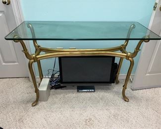 Glass top sofa table with gold metal base