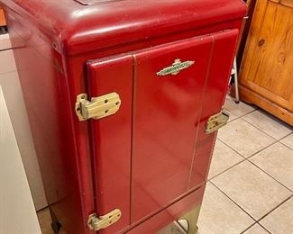 Refurbished vintage refrigerator not working used as a cabinet