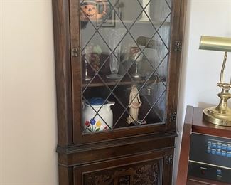 Carved corner cabinet