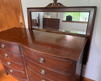 Black walnut chest of drawers with attachable mirror.
