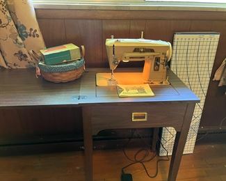 Singer 104 sewing machine, c. 1959.  Still runs, and comes with attachments and table!