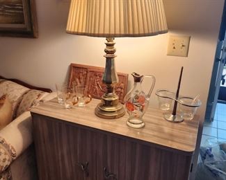 MCM laminate cabinet, brass lamp, MCM Carafe and serving pieces