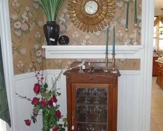 Great sunburst clock and antique cabinet