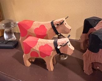 folk art carved cows