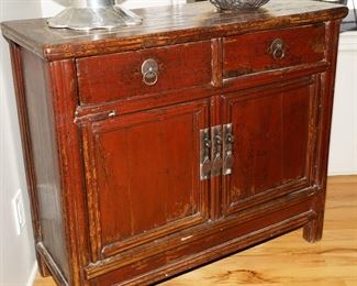 Antique Chinese red lacquered cabinet.  There are two of these available for sale actually. 