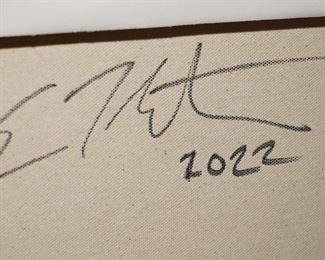 Signature on the back of the black artwork