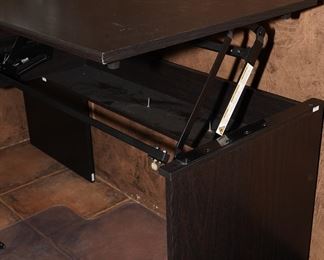 Note the lift on this Bush L-shaped computer desk