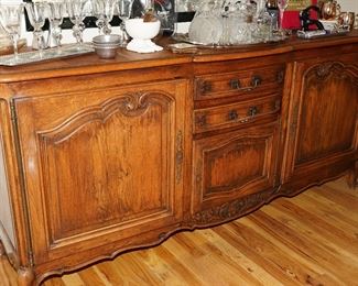 Antique carved wood buffet cabinet with dove tail joints.