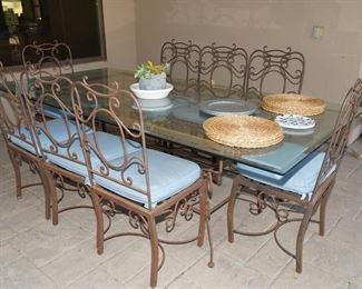 Custom wrought iron glass topped patio table with chairs