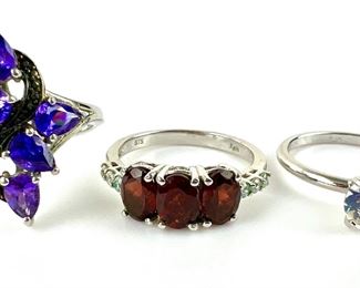 Two Silver Karis Gemstone Rings
(Purple and Red) AND a Clear Round Crystal
Solitaire Ring - Sizes 8-9