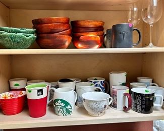 Collection of Starbucks coffee cups and mugs