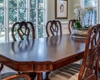 Traditional dining table with 8 chairs, 2 leaves and pads.  Perfect condition