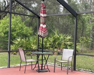 $125 Small table with 2 chairs and umbrella