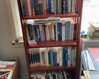 Bookcase filled with a variety of books 